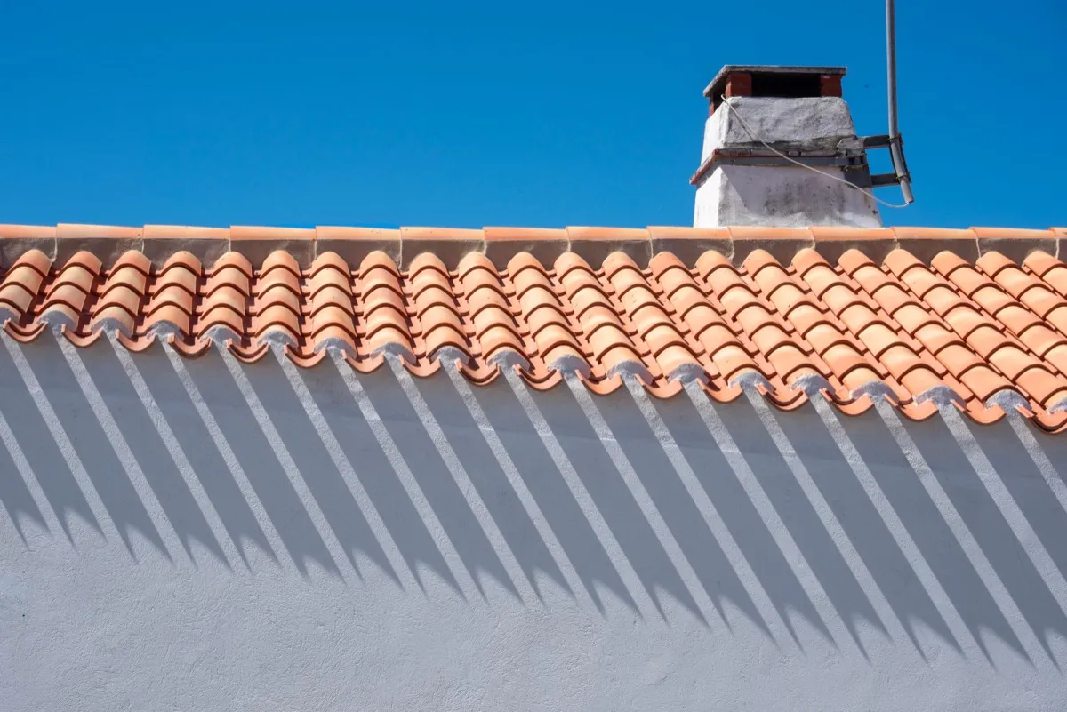 Roof ridge line and chimney on a home in Tulsa, OK